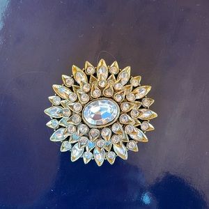 Striking rhinestone and gold tone brooch worthy of a Maharaja